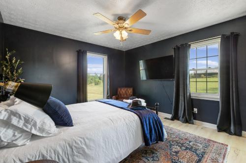a bedroom with a bed and a ceiling fan at Bourbon Trail-Speakeasy&Golf&Spa&Dog Friendly in Frankfort