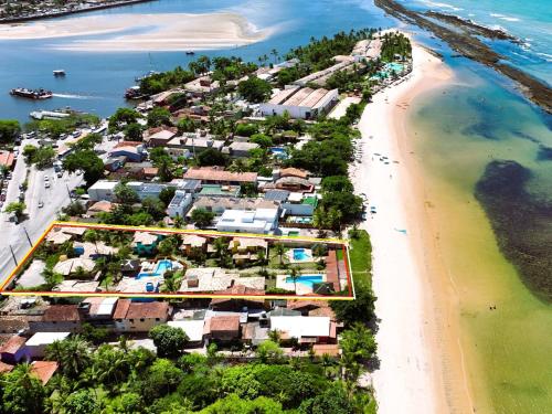 an aerial view of a resort on a beach at Residence Maria Vittoria Praia Arraial in Arraial d'Ajuda