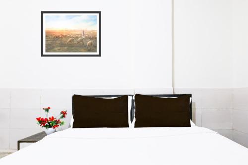 Postel nebo postele na pokoji v ubytování Super Hotel O Fazalpur