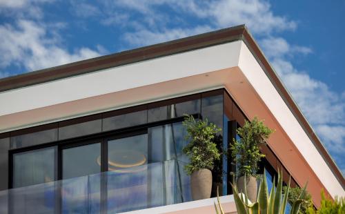 a house with black windows and cactus at Porto Lotti Suite Hotel in La Spezia