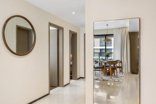 a hallway with a mirror and a dining room at GTC Elephant 2 bed by YourHost Nairobi in Nairobi