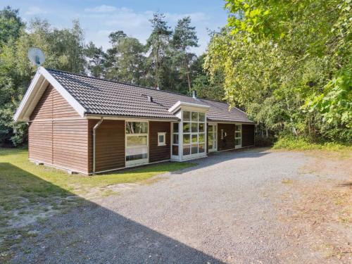 a detached house with a garage and a driveway at Holiday Home Dorit - 600m from the sea by Interhome in Hasle