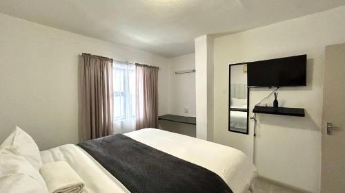 Ένα ή περισσότερα κρεβάτια σε δωμάτιο στο A-lux BnB