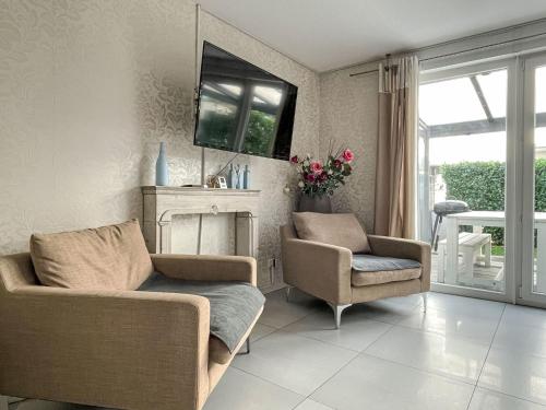 a living room with a couch and two chairs at Holiday Home Knapp by Interhome in Breisach am Rhein