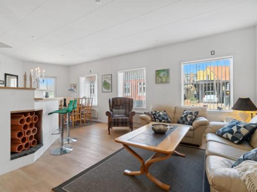 a living room with a couch and a table at Apartment Dagne - 400m from the sea by Interhome in Hasle