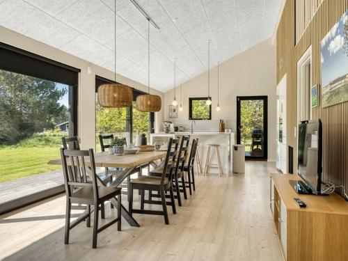 a dining room with a long table and chairs at Holiday Home Alfrede - from the sea by Interhome in Hals