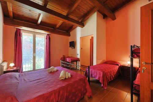 a bedroom with two beds and a window at Bed And Breakfast Sciarammola in Patti