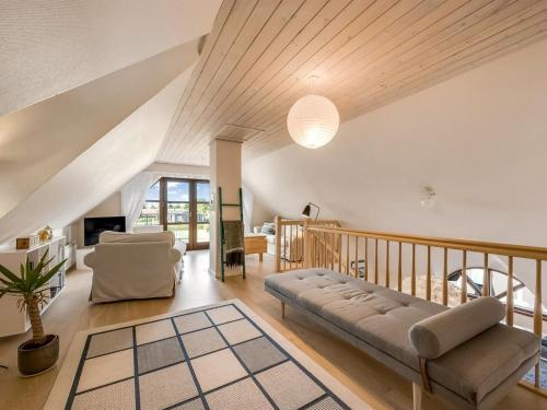 a living room with a couch and a table at Holiday Home Hendrina - 250m to the fjord by Interhome in Skjern