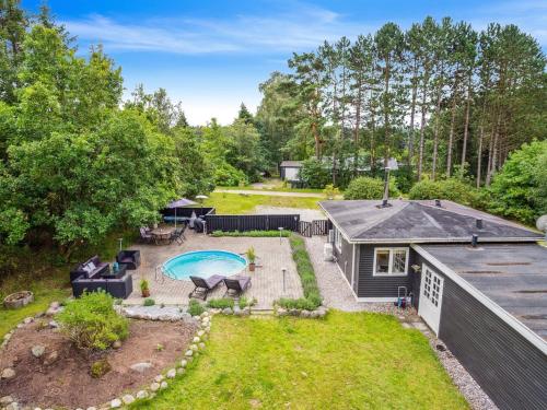 an aerial view of a backyard with a pool and a house at Holiday Home Fritsa - 8km from the sea by Interhome in Ebeltoft