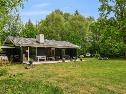 a house with a patio and a yard at Holiday Home Judyta - 250m to the inlet by Interhome in Nakke