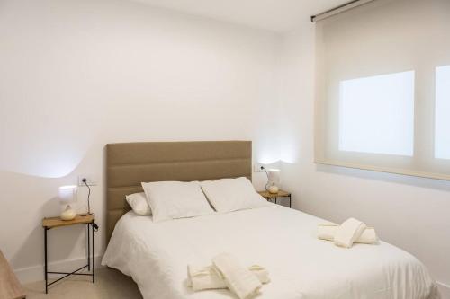 Ένα ή περισσότερα κρεβάτια σε δωμάτιο στο Royar Apartamentos