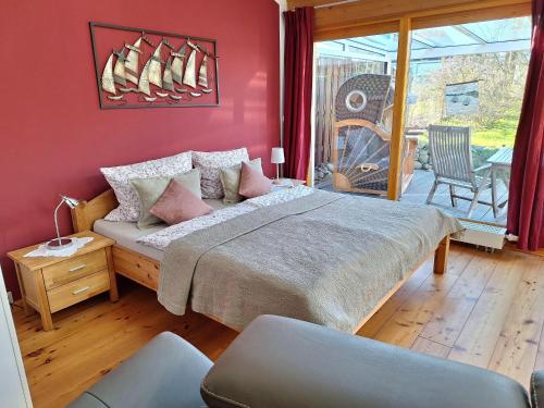 a bedroom with a large bed with sails on the wall at Ferienhaus-am-Kuhmoor in Wismar