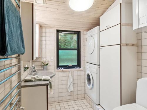 a laundry room with a washer and dryer at Holiday Home Aiko - 375m from the sea by Interhome in Store Fuglede