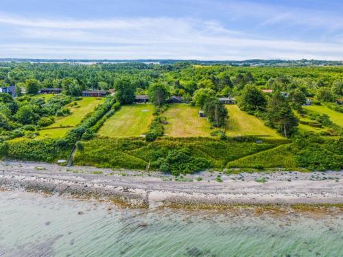 an aerial view of the shoreline of a lake at Holiday Home Eyer - 20m from the sea by Interhome in Korsør