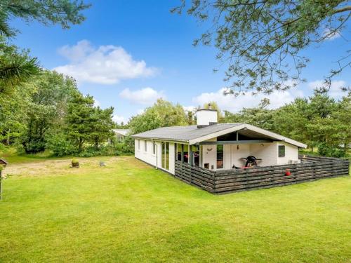 a small white house with a large yard at Holiday Home Pia - 250m to the fjord by Interhome in Sindrup