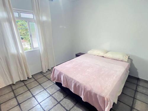 Postel nebo postele na pokoji v ubytování Casa Joaninha Biasutti