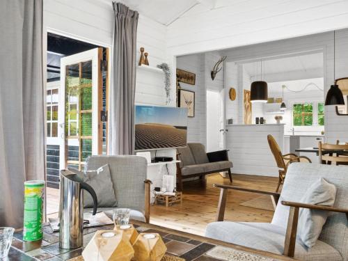 a living room with chairs and a table at Holiday Home Neela - 300m from the sea by Interhome in Marielyst