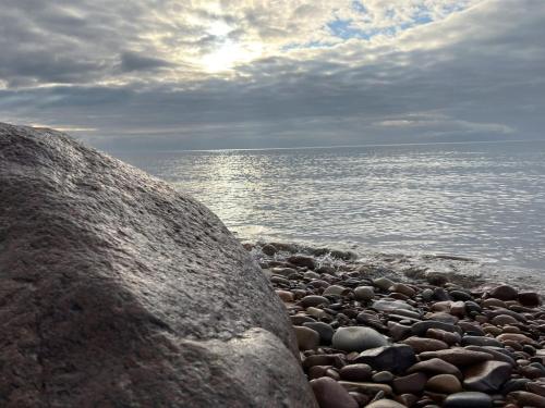 a group of rocks on a beach near the water at Holiday Home Lucie - 50m from the sea by Interhome in Rønne