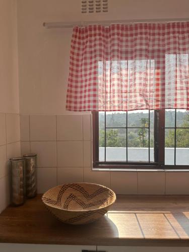 a bowl on a table in a kitchen with a window at Cosy Cottage - All to Yourself! in Durban