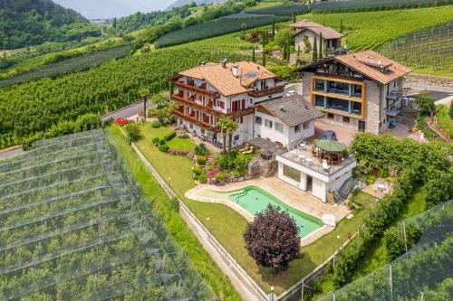 an aerial view of a house in a vineyard at Plarserhof in Lagundo