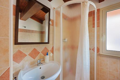 a bathroom with a sink and a shower at Bed And Breakfast Sciarammola in Patti
