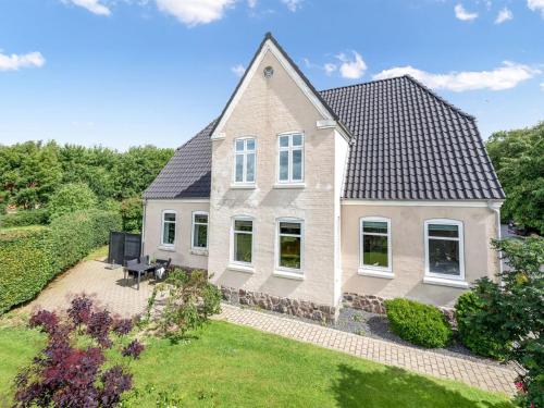 an aerial view of a house with a yard at Holiday Home Amma - 21km from the sea by Interhome in Bredebro