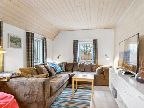 a living room with a couch and a table at Holiday Home Annli - 800m to the fjord by Interhome in Fur