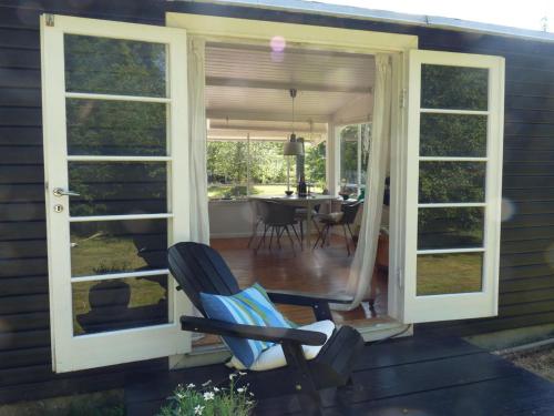 a screened in porch with chairs and a table at Holiday Home Elisa - 600m from the sea by Interhome in Gedser