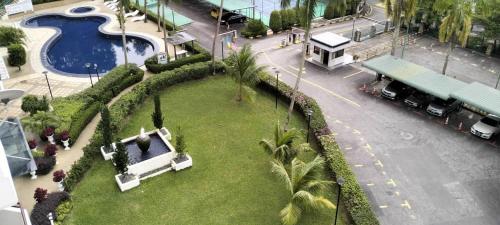 an aerial view of a park with a swimming pool at sri sayang apartment in Batu Ferringhi