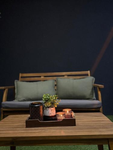 a coffee table with a couch in the background at Apartman Dukat- Luksuzna novogradnja u srcu Vinkovaca s parkingom in Vinkovci