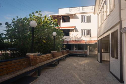 a row of benches in front of a building at Coral View Beach Resort in Utila