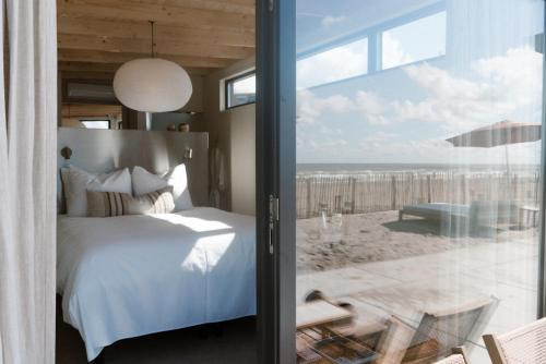 Postel nebo postele na pokoji v ubytování Piatti beach suites