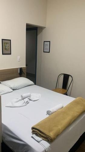 Ein Bett oder Betten in einem Zimmer der Unterkunft AVENIDA HOTEL DE RESENDE