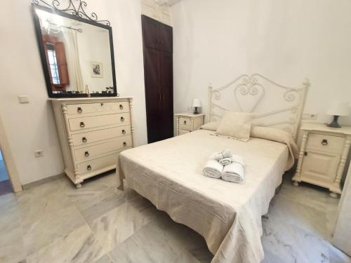 En eller flere senge i et værelse på EL TESORILLO