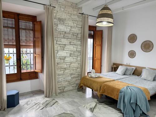 En eller flere senge i et værelse på EL TESORILLO