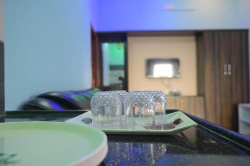 a pair of glasses sitting on top of a table at Rs residency Yercaud in Salem