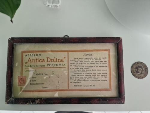 a picture of a document in a frame on a wall at Antica Dolina in Postojna