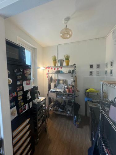 a cluttered room with a room with a room at Shared room for 1 male traveler No private room in Paris