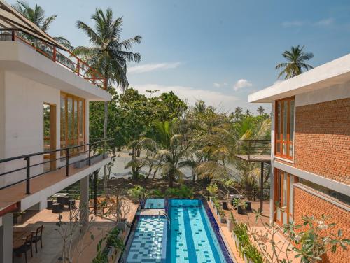 an aerial view of the pool at a resort at Ko Lake Room in Ahangama