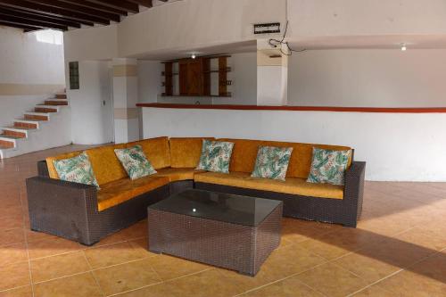 a living room with a couch and a coffee table at Escape to Nature in Copacabanas Hidden Gem in Copacabana