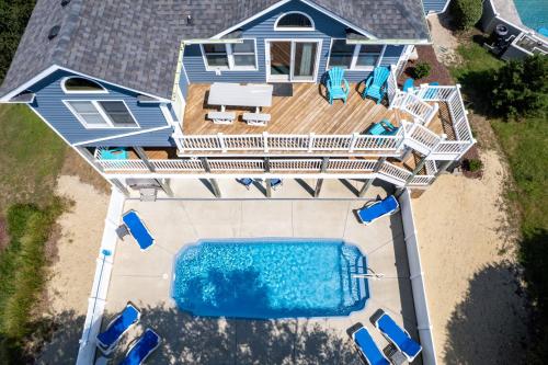 an aerial view of a house with a swimming pool at 2072 - Laughing Duck in Duck