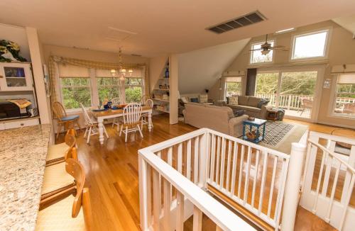 a large living room with a staircase and a living room at Pappia in Duck