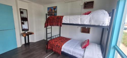 Postel nebo postele na pokoji v ubytování Hostel Kuntur