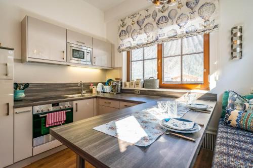 a kitchen with a table and a counter top at Appartements Mair in Mayrhofen