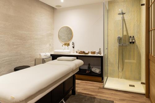 a bathroom with a shower and a sink at Pousadela Village & Spa in Vieira do Minho