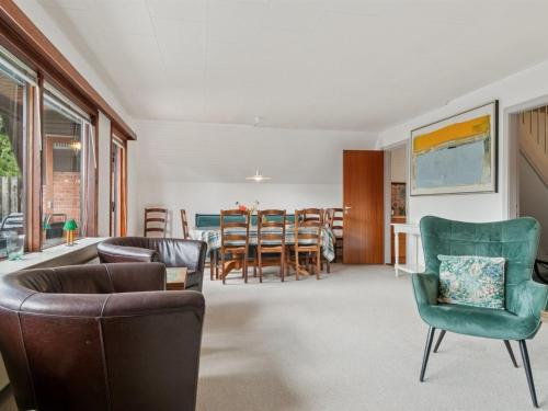 a living room with a couch and chairs and a table at Holiday Home Hildegunda - 280m from the sea by Interhome in Neksø