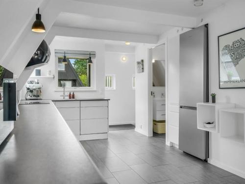a white kitchen with white counters and white cabinets at Holiday Home Ernstine by Interhome in Farsø