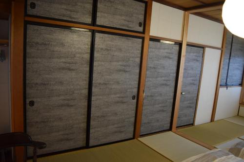 Una cama o camas en una habitación de 飛騨棲家 花里憩
