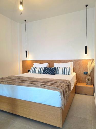 Ένα ή περισσότερα κρεβάτια σε δωμάτιο στο aelia beach living II