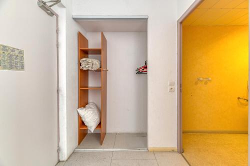 an empty room with a door and a closet at Logis Belledonne in Arvillard